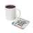 White mug next to coaster with text "I am becoming the best version of myself".
