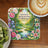 Coaster with Matthew 11:28 Bible verse and floral landscape.