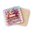 Coaster with stacked books and flowers, reading "Not Now, I'm Reading."