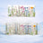 Mug trio with floral watercolor design, set against a snowy background.