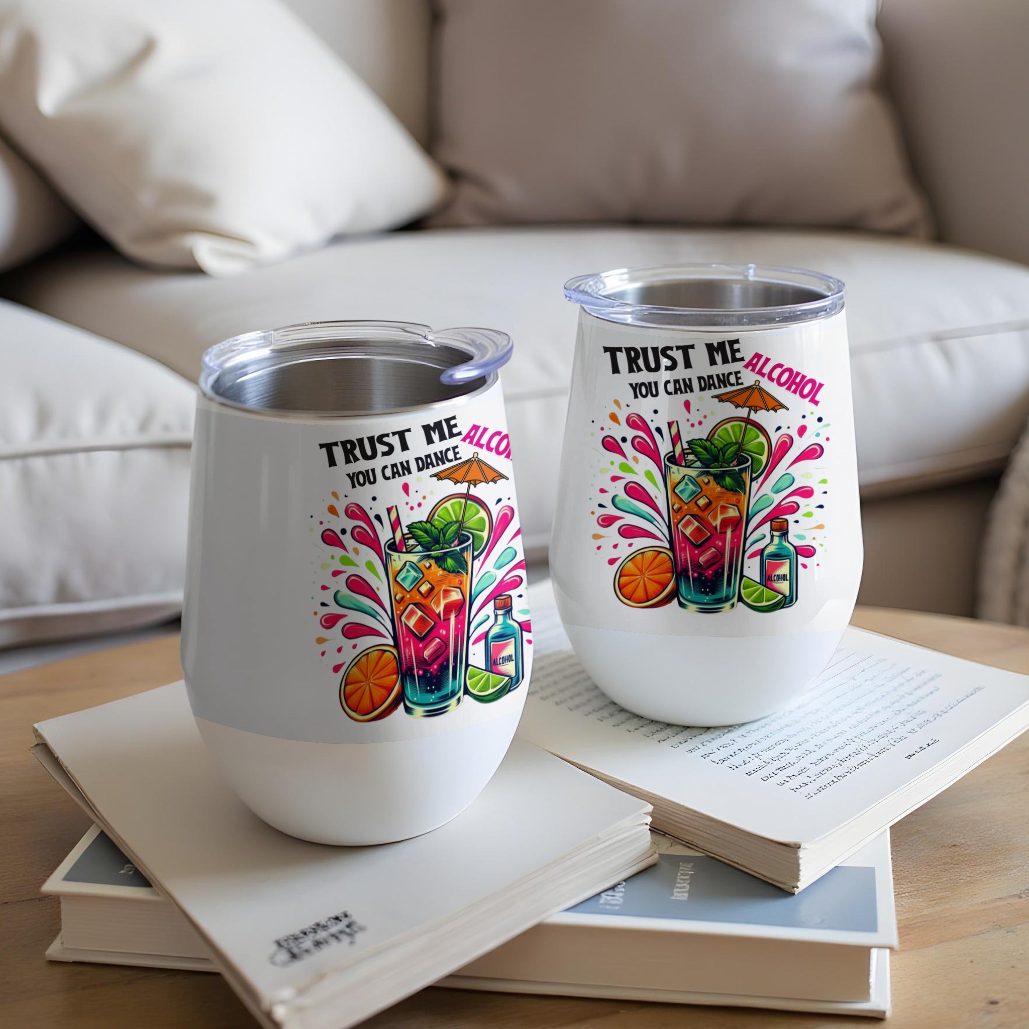 White stemless wine tumblers with "Trust me you can dance" and cocktail graphics.