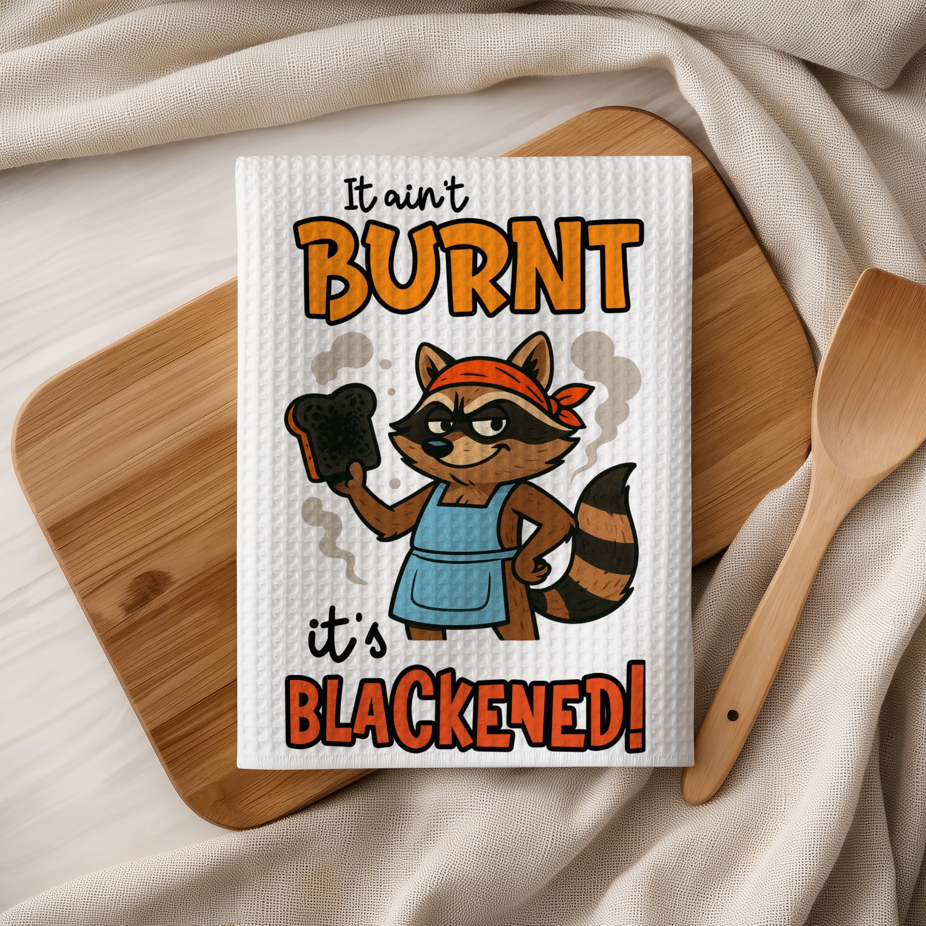 Burnt and blackened raccoon chef with bread on wooden cutting board.
