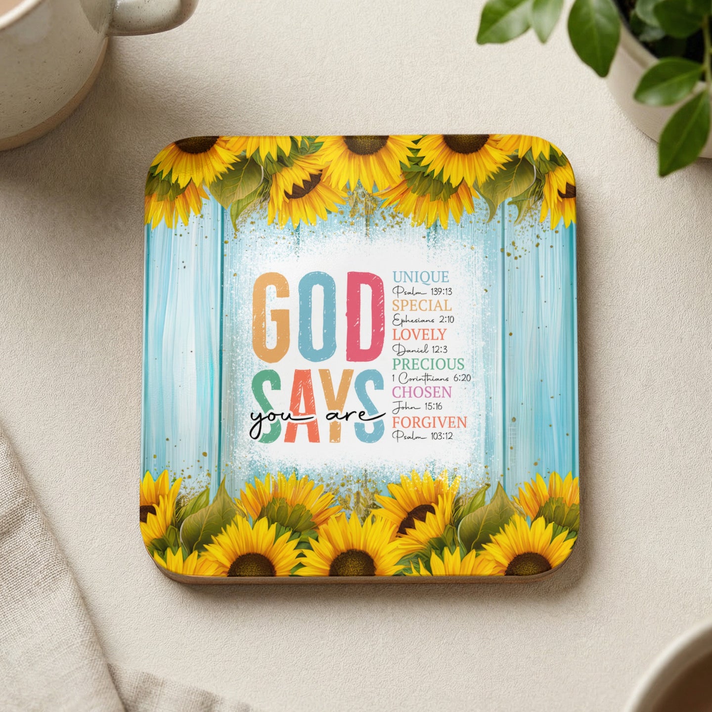 "God Says You Are" text with sunflowers and Bible verses on a wooden background.