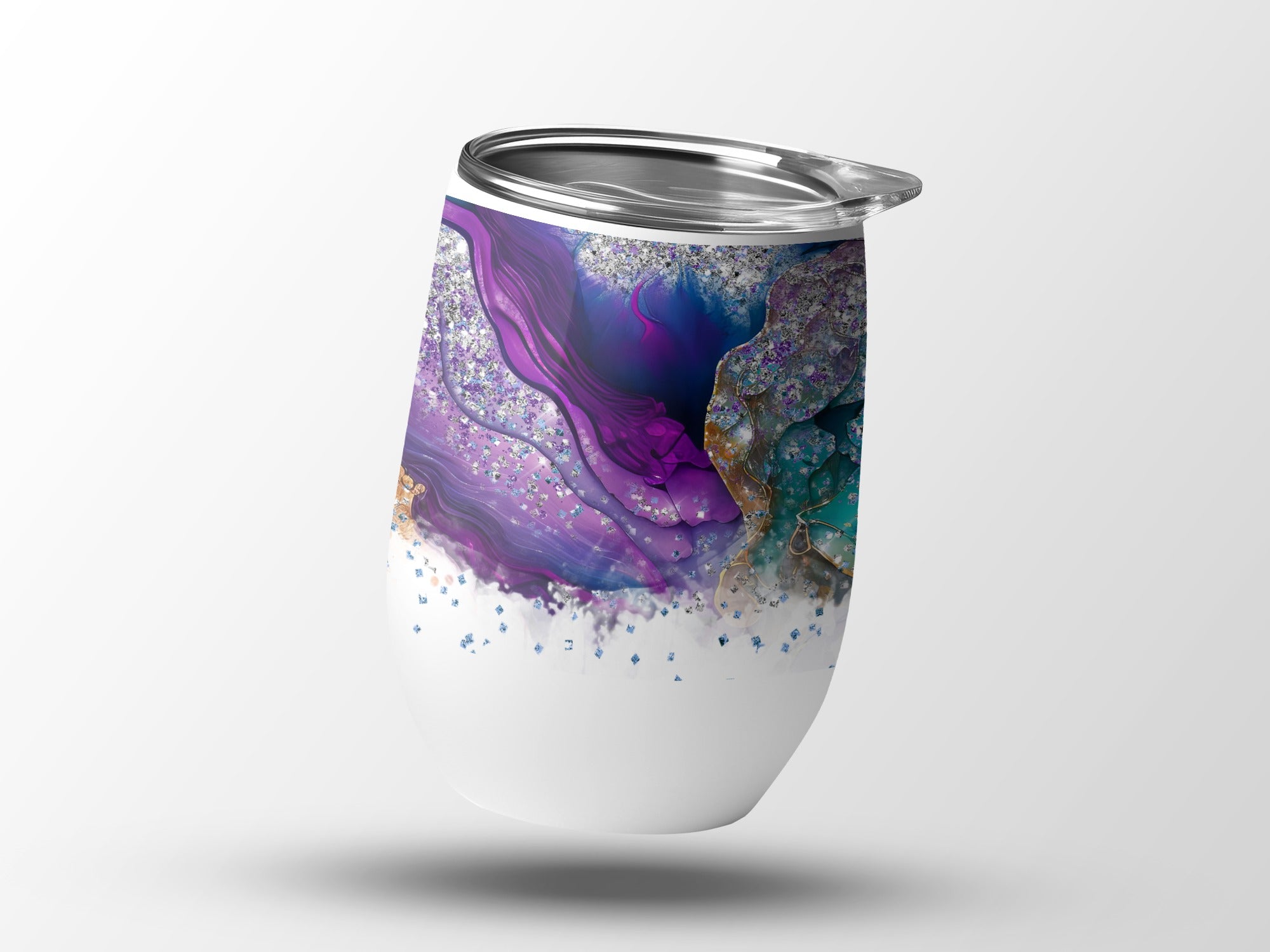 White tumbler with purple, blue, and gold abstract marbled design.