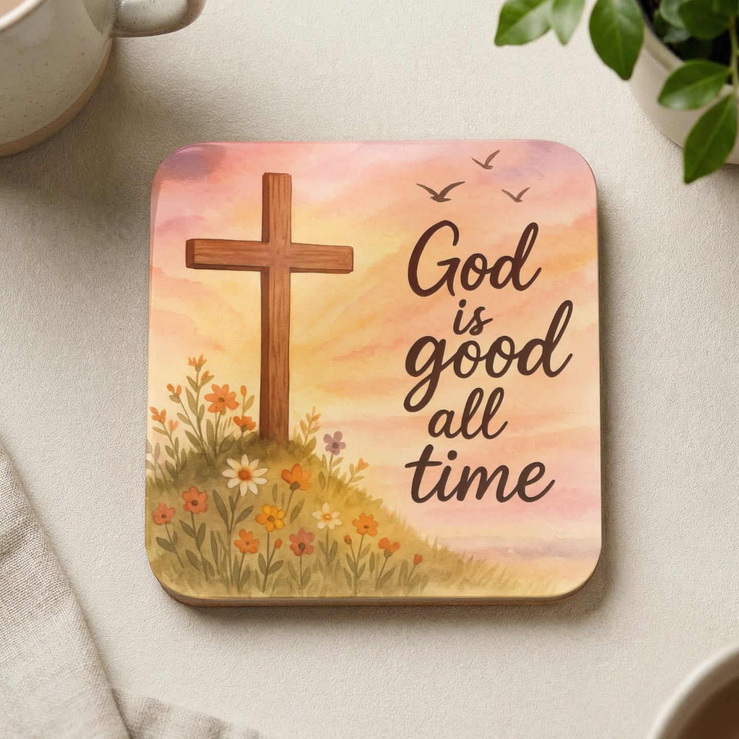 Wooden coaster with a cross, flowers, and "God is good all time" text.