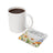 White mug next to a floral coaster reading "I'm limited edition."