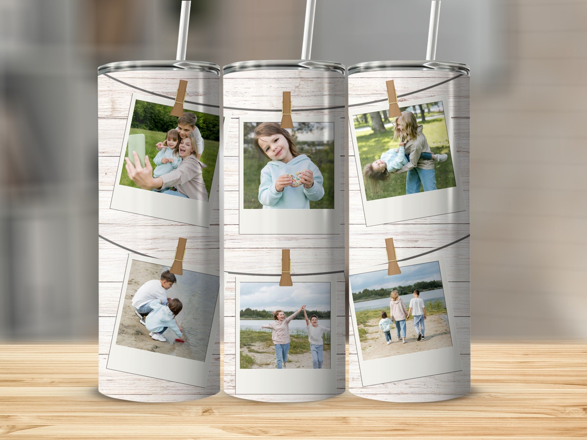Tumbler with multiple framed photos of children and families on a wooden background.