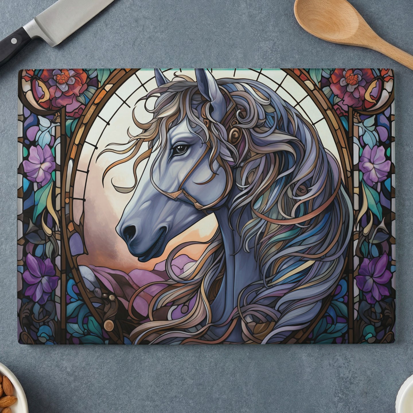 Stained glass horse head with ornate mane and floral border.