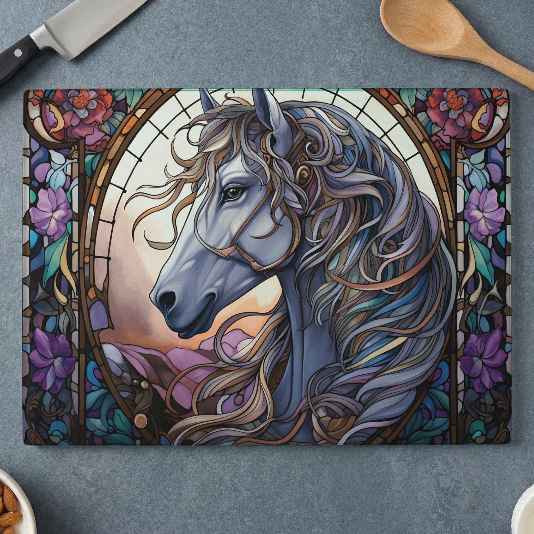 Stained glass horse head with ornate mane and floral border.