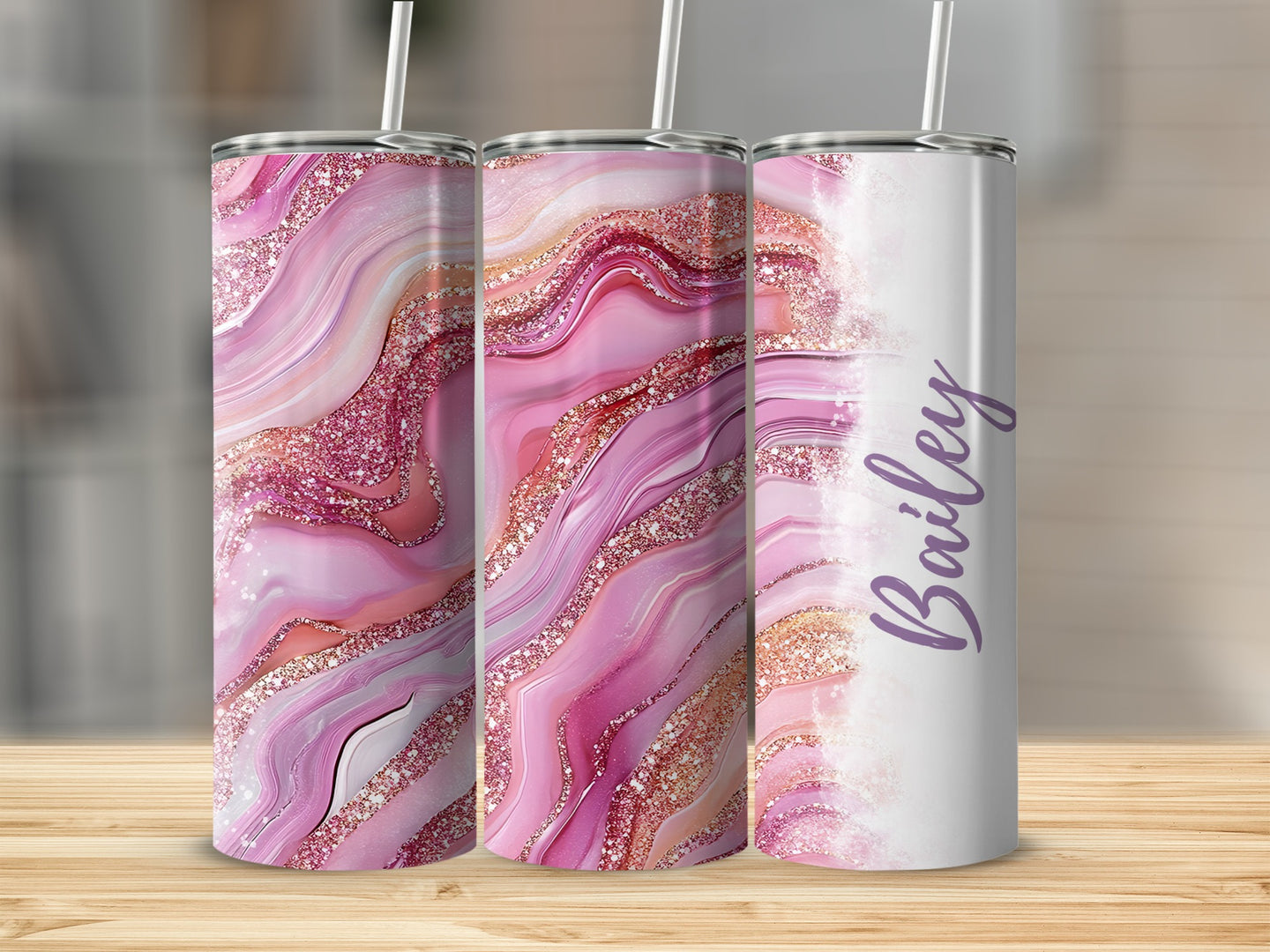 Three tumblers with pink, glittery marble patterns and "Bailey" text.