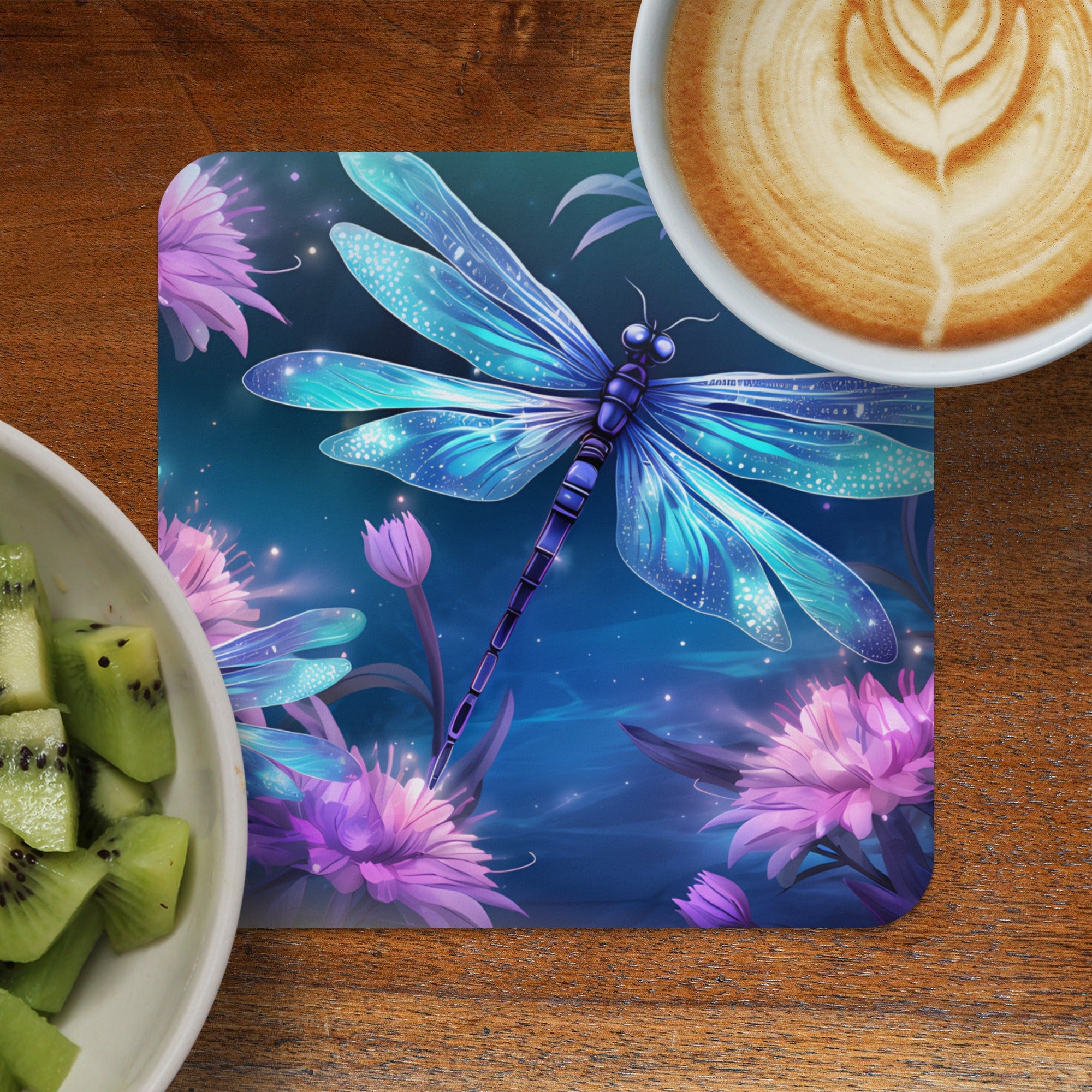 Blue dragonfly on floral background with coffee and kiwi.