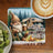 Gnome holding mug next to camper with text "making memories at a time".