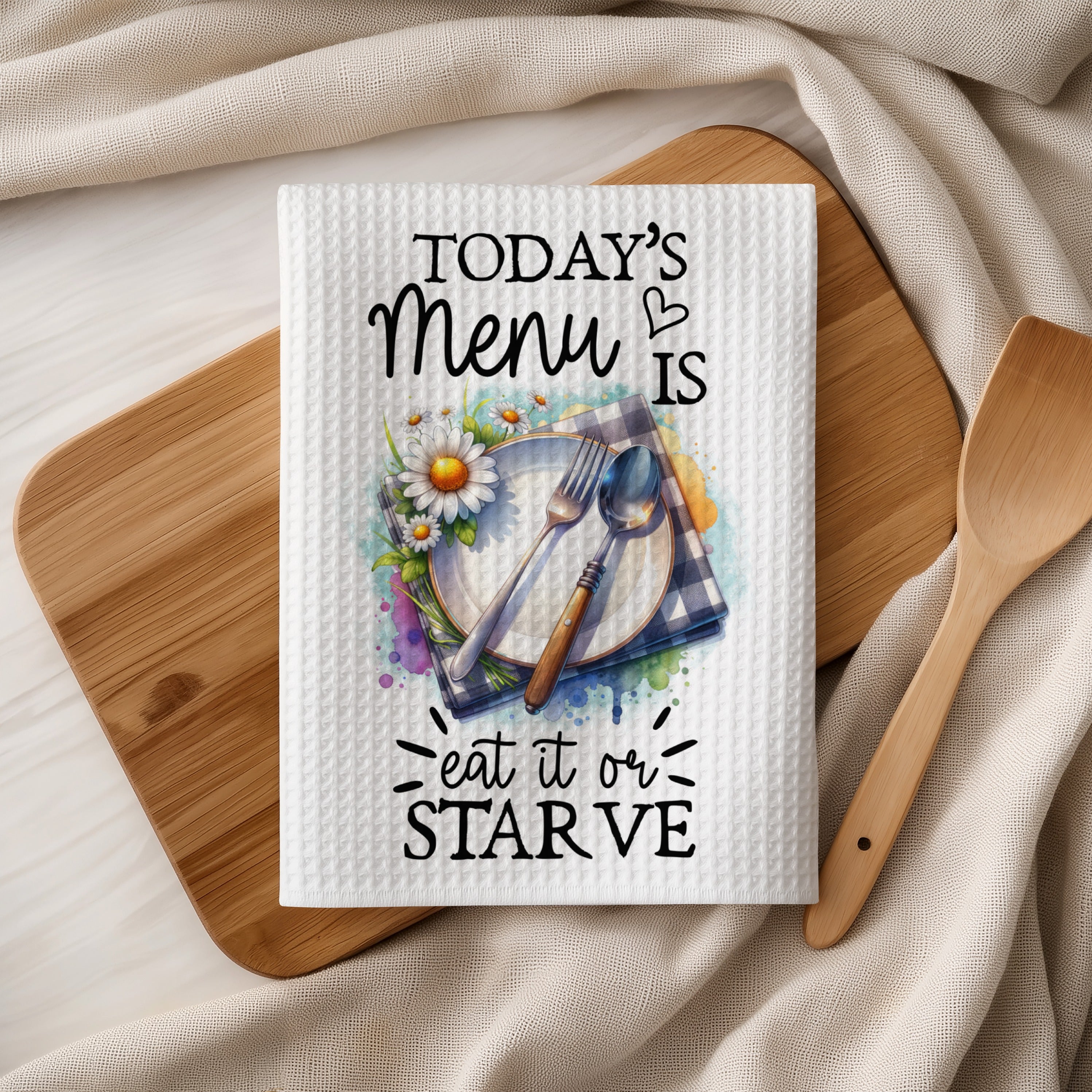 Kitchen towel with "Today's Menu is Eat It or Starve" text and floral design.