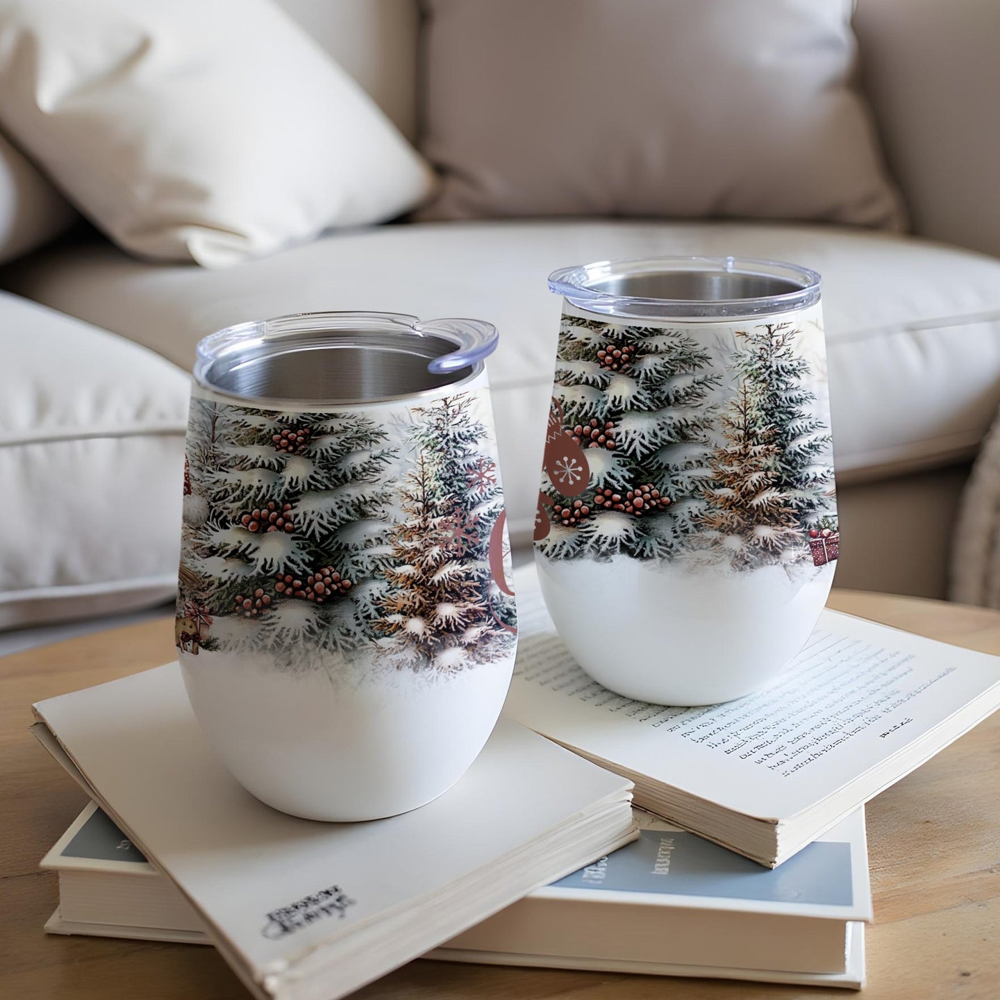 Two insulated wine tumblers with a snowy forest and cabin design.