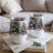 Two insulated wine tumblers with a snowy forest and cabin design.
