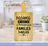 Bamboo cutting board with "Kitchens are for bringing families together" text.