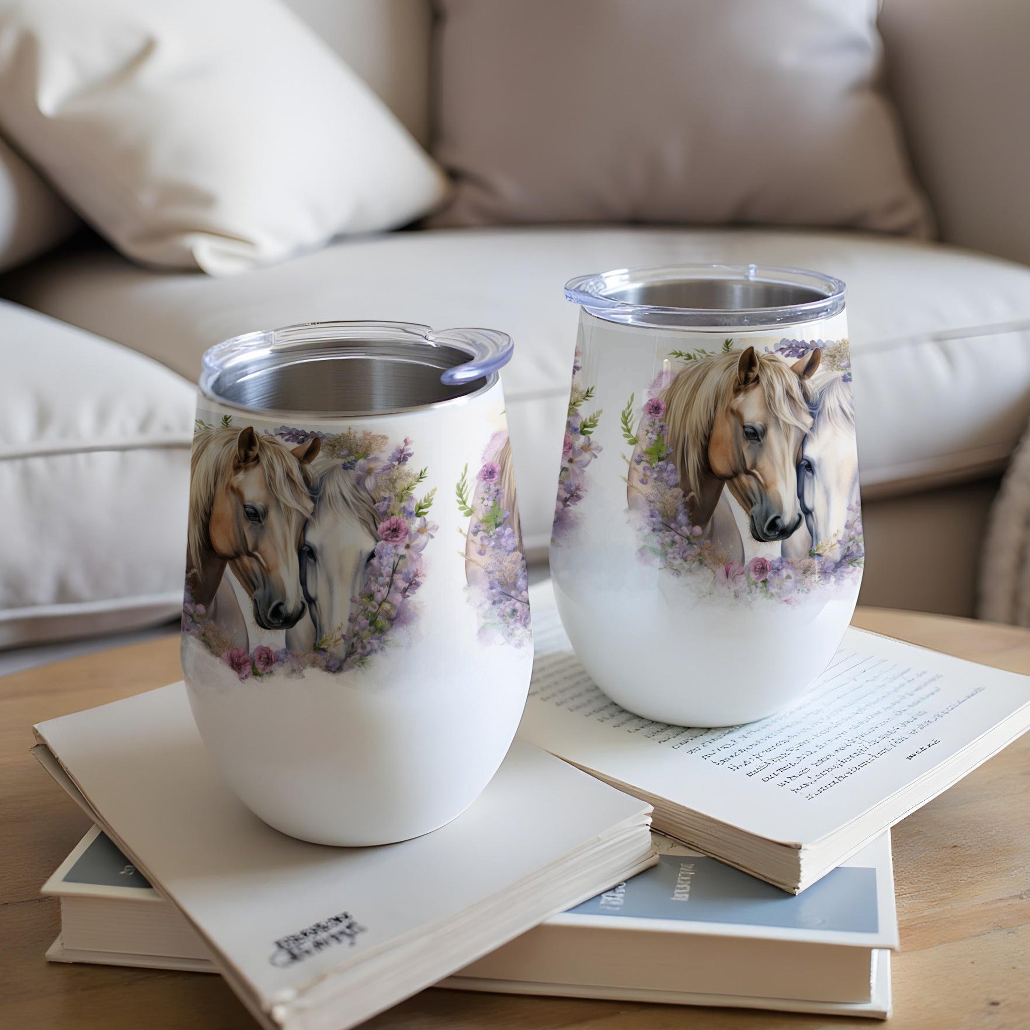 Two white tumblers featuring horses and floral design.