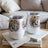 Two white tumblers featuring horses and floral design.