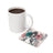 White mug of coffee next to a coaster with a woman and text "Self-Care IS NOT Selfpy".