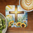 Watercolor cross with sunflowers, blue flowers, and sunburst over coffee and kiwi slices.