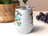 White tumbler with "DAD" in tools and colorful letters.