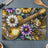 Acoustic guitar nestled among colorful floral designs on a cutting board.