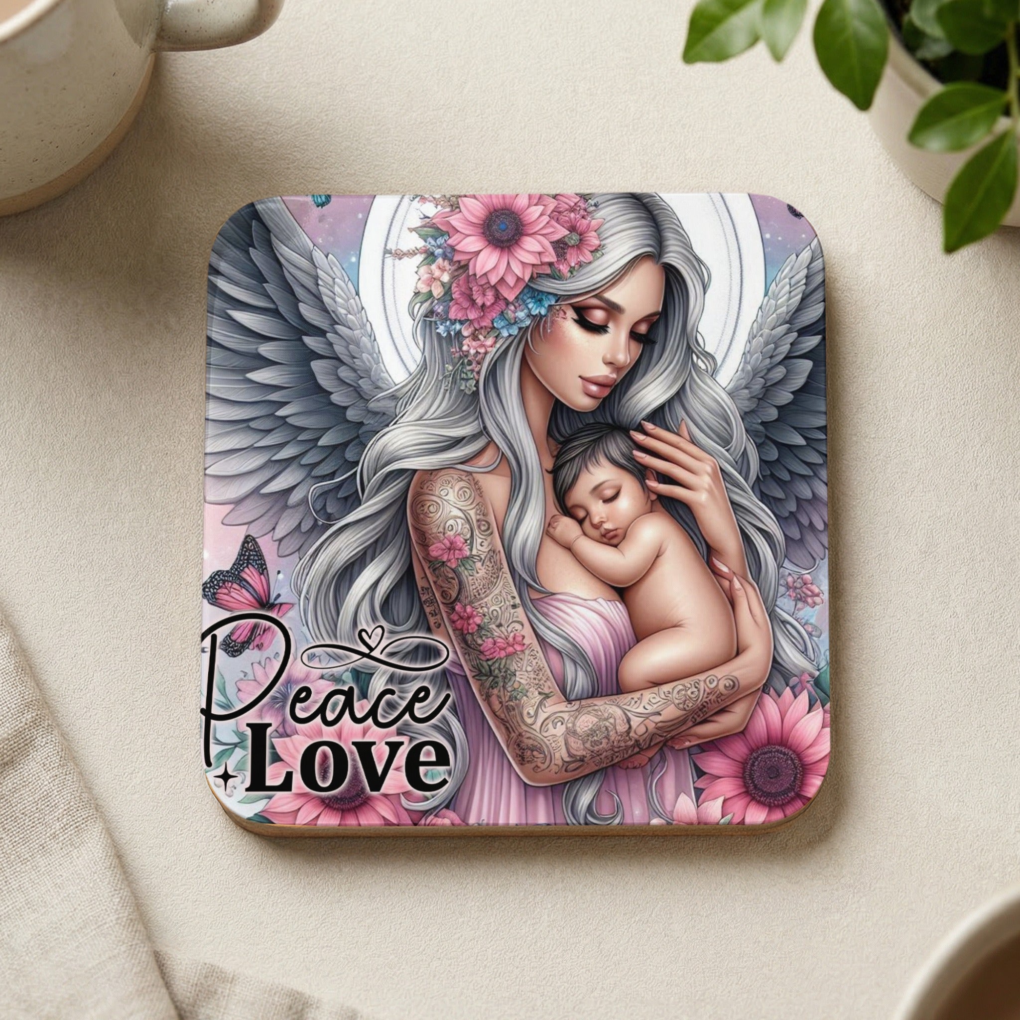 Angel holding baby, with floral details and "Peace Love" text.