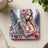 Angel holding baby, with floral details and "Peace Love" text.