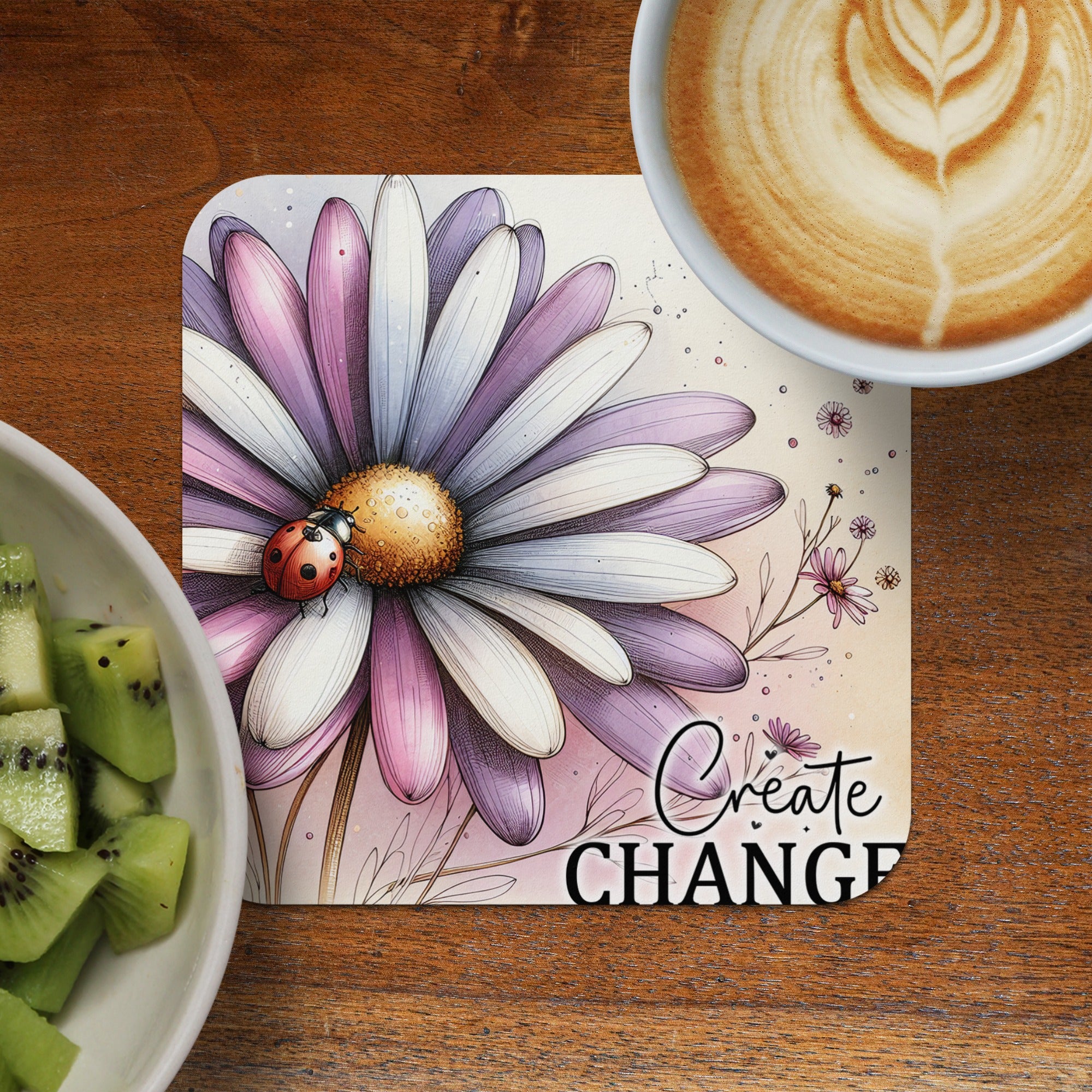 Coaster with purple and white daisy, ladybug, and "Create Change" text.