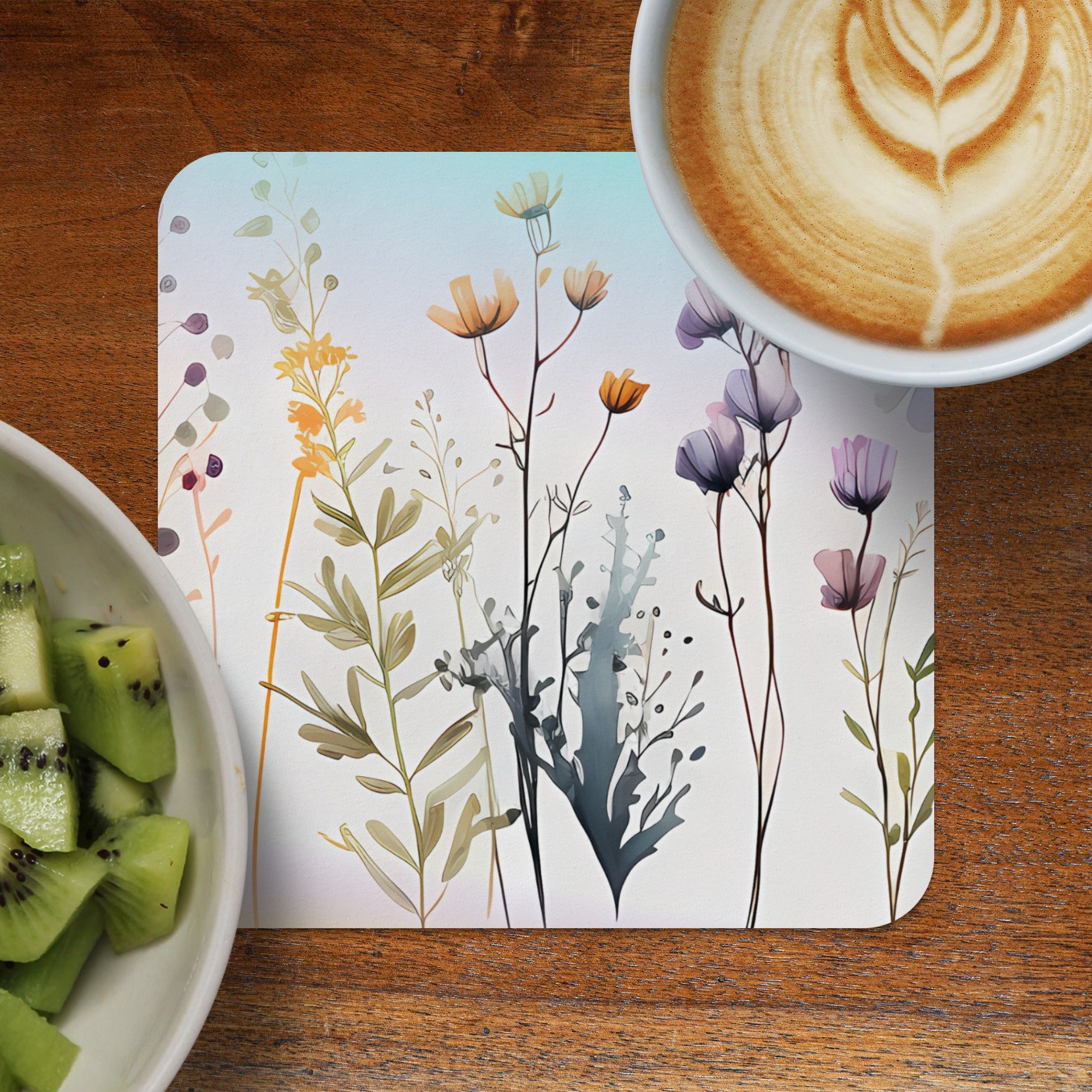 Floral illustration on a placemat with coffee and kiwi.
