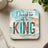 Coaster with "Daughter of a King" text and 2 Corinthians 6:18.