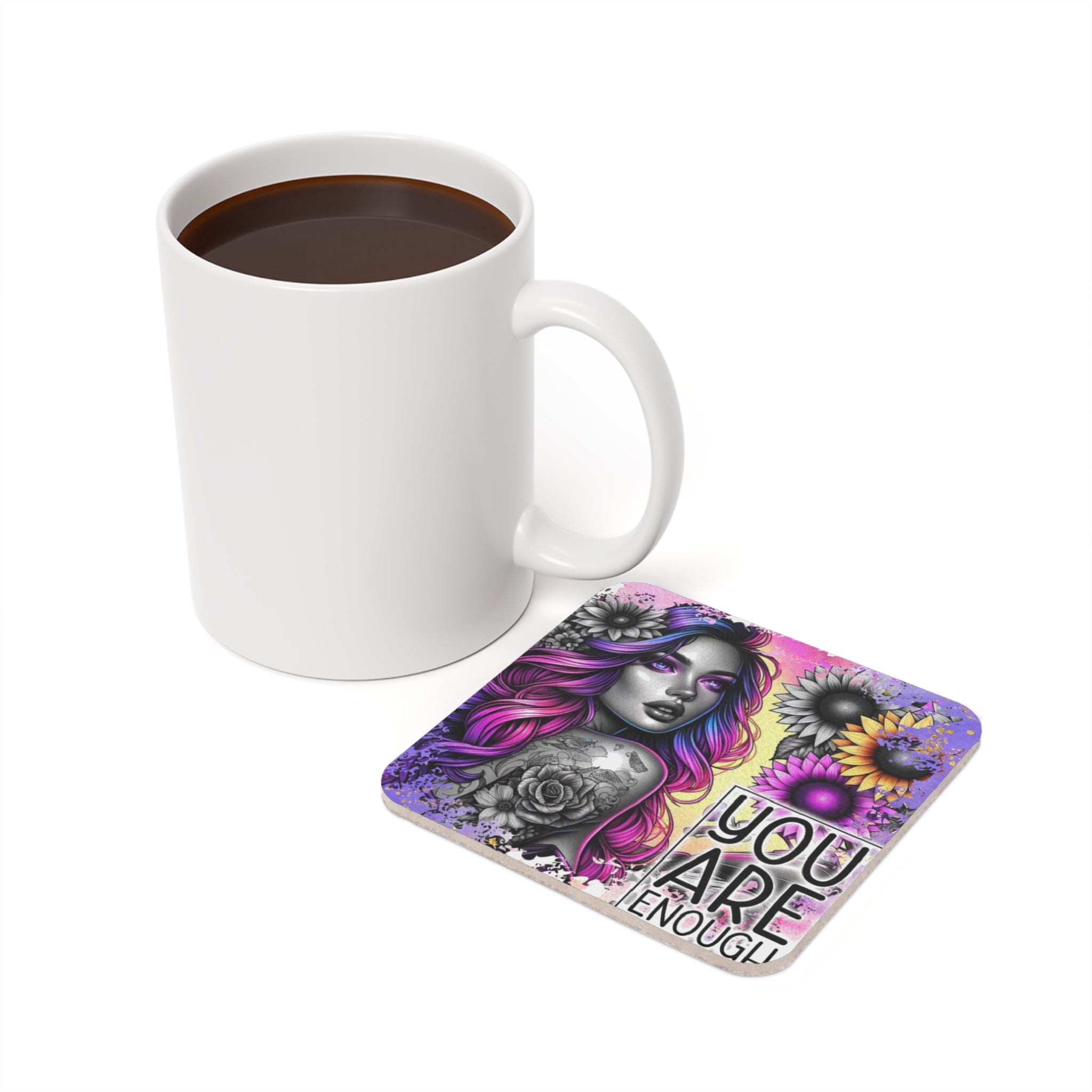 White mug next to a coaster with a woman and "YOU ARE ENOUGH" text.