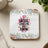 Coaster with pink floral border and text "Jesus Loves Me, This I Know".