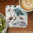 Coaster with flowers and "Be Strong Brave Fearless" text, next to kiwi and coffee.