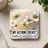 Square coaster with white and yellow cosmos flowers and "MY ACTIONS CREATE constant prosperity" text.