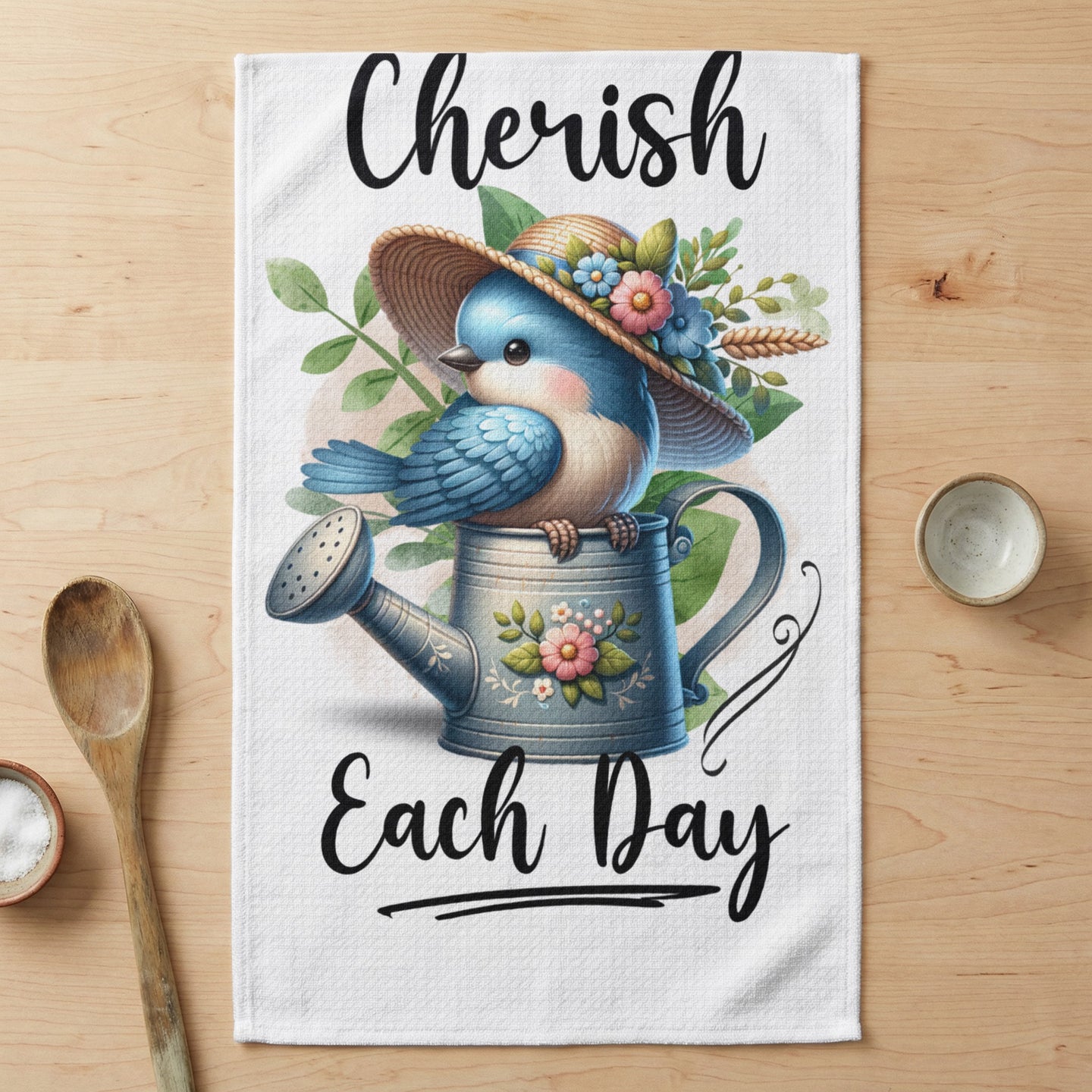 Bluebird wearing a straw hat sits on a watering can with text "Cherish Each Day".