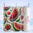 Watermelon slices and poinsettias pattern on a tumbler.