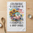 Towel with watercolor illustration of a camper, sunflowers, and American flag, text reads "CELEBRATE FREEDOM & OPEN ROADS".