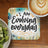 Coaster with "I AM Evolving everyday" text and latte art coffee cup.