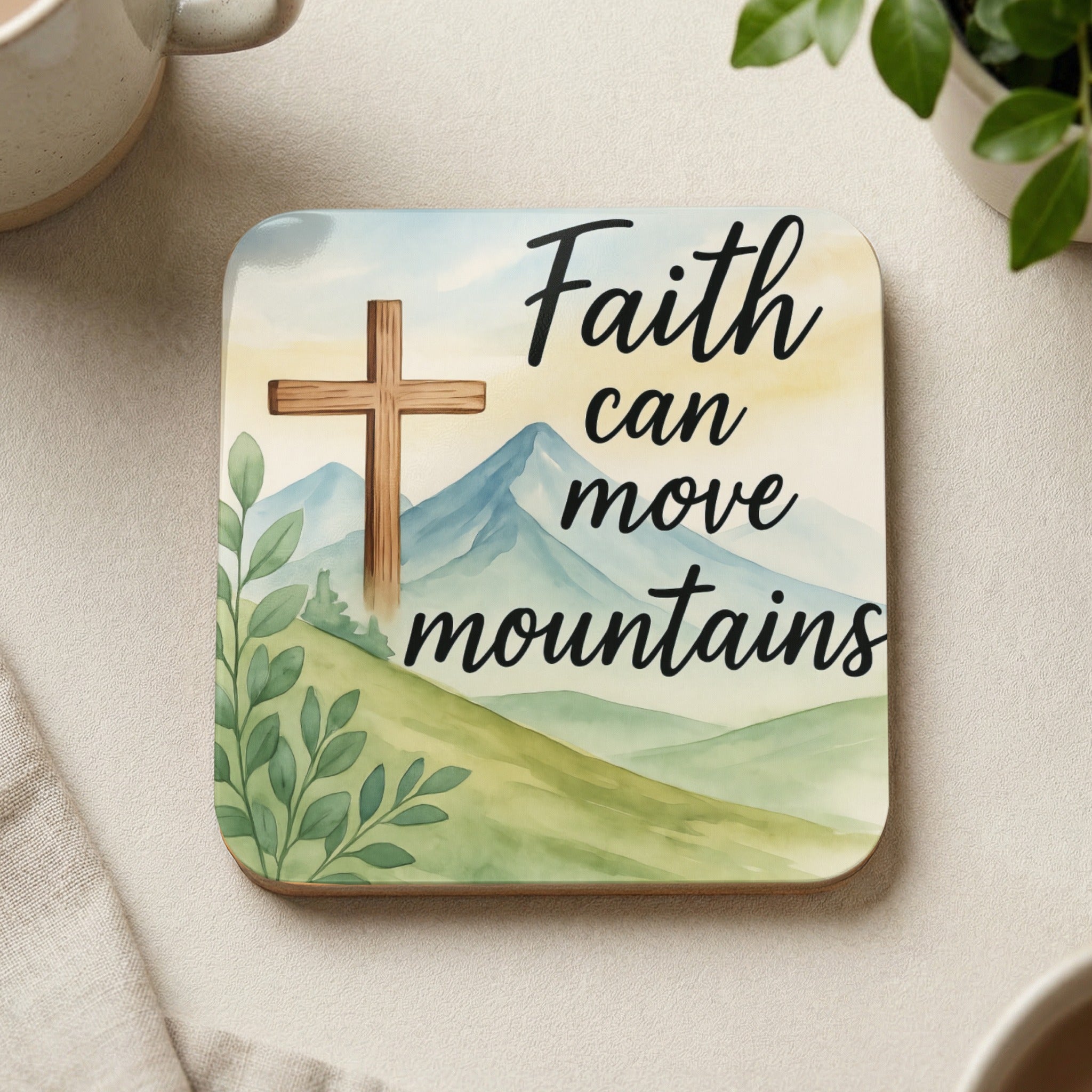 Cross on mountains with text "Faith can move mountains"