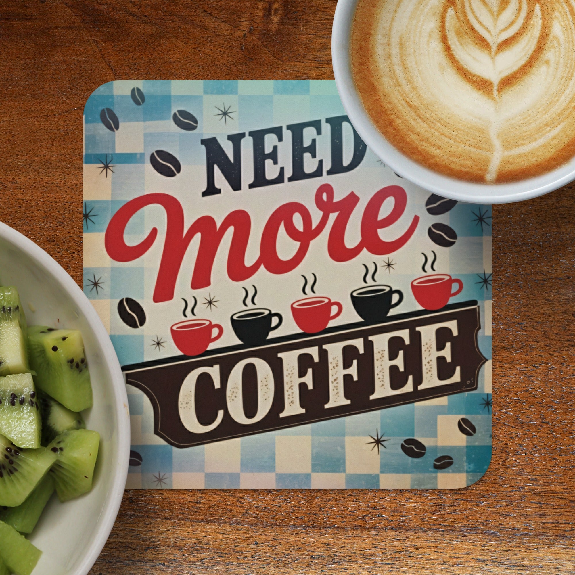 Coaster with "Need More Coffee" text and coffee cup latte art.