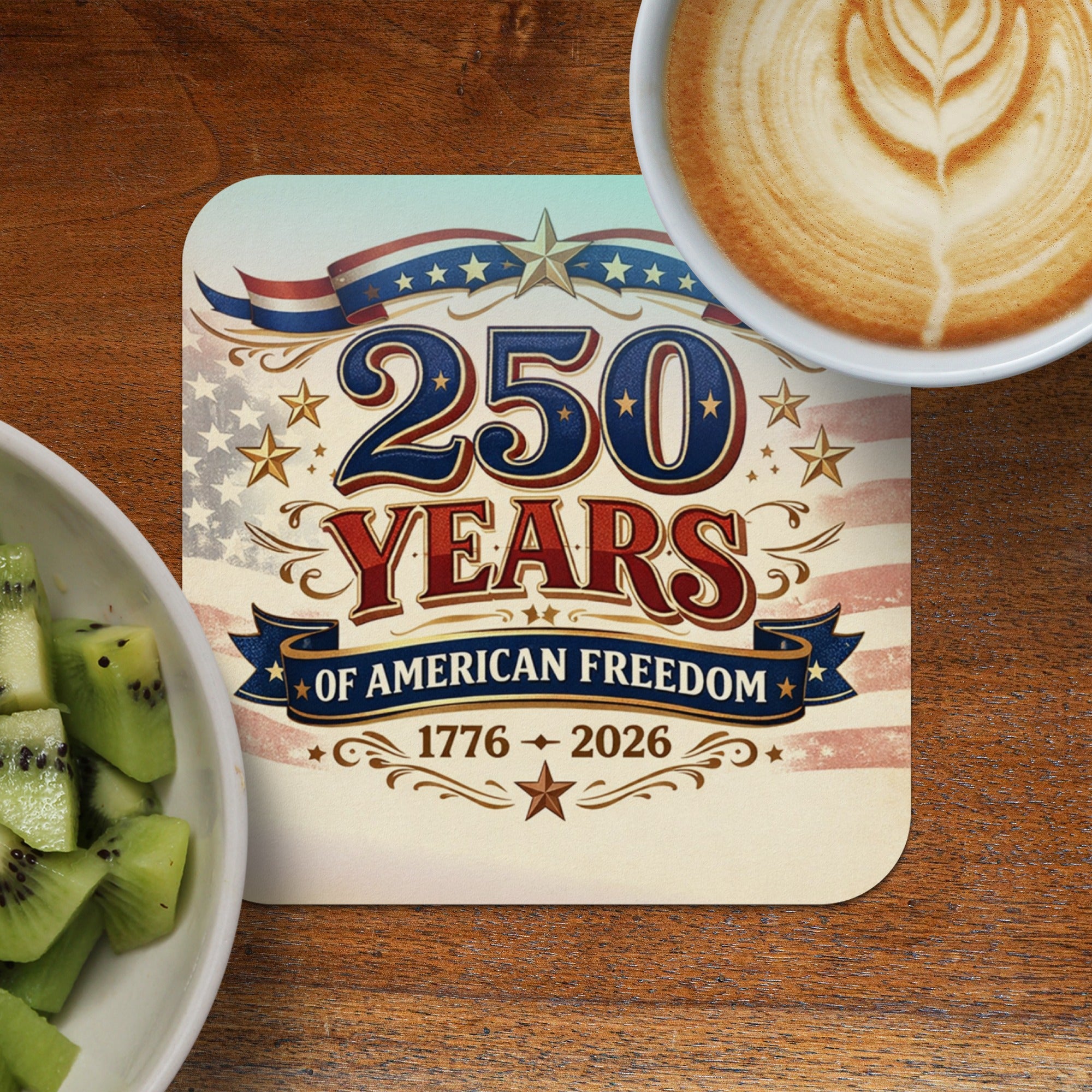 250 Years of American Freedom 1776-2026 patriotic coaster with coffee and fruit.