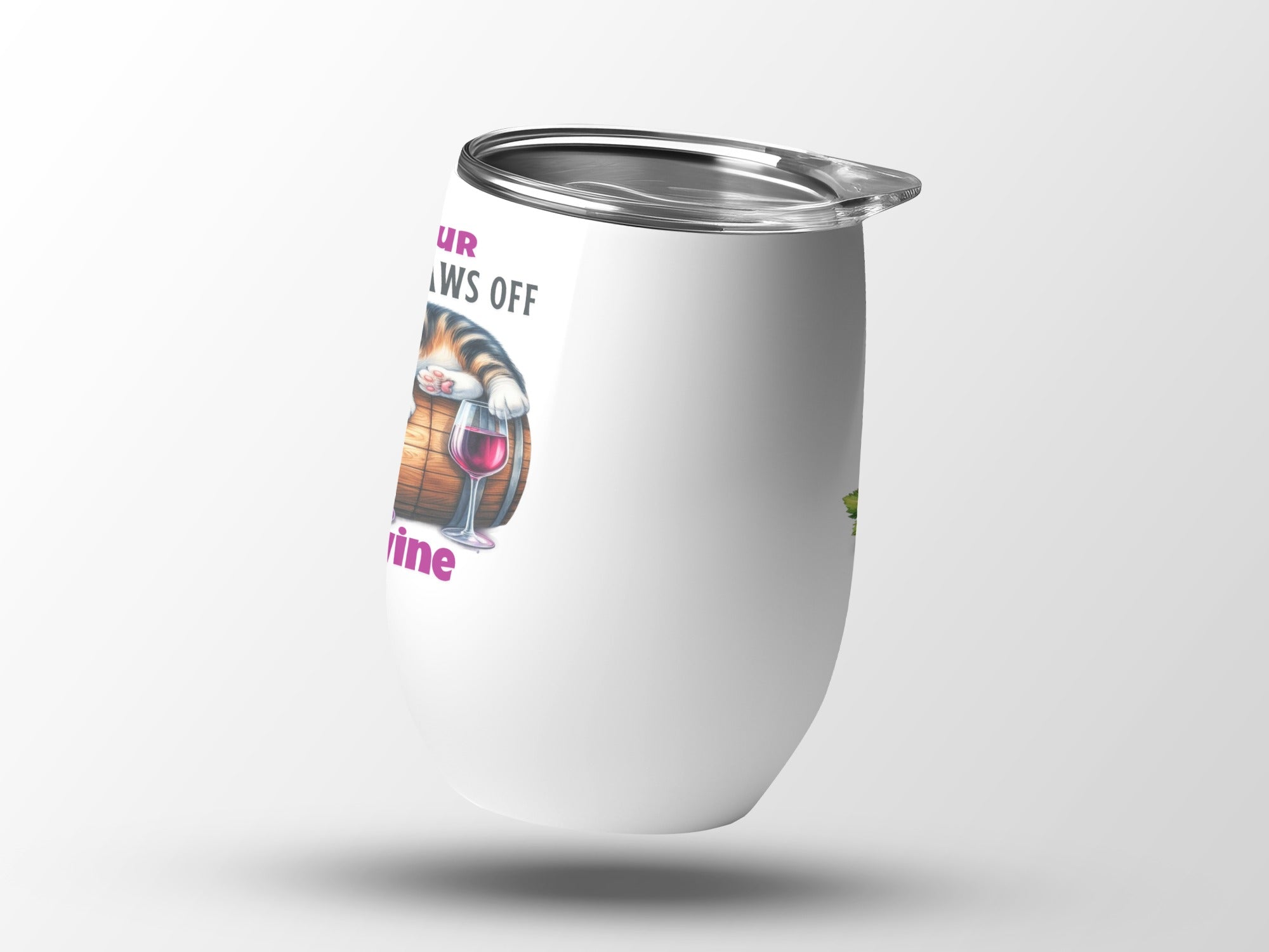 White wine tumbler with a cat's paws reaching from a barrel and wine glass.