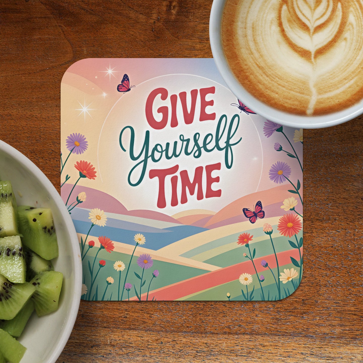 Coaster with "Give Yourself Time" text and a colorful landscape.