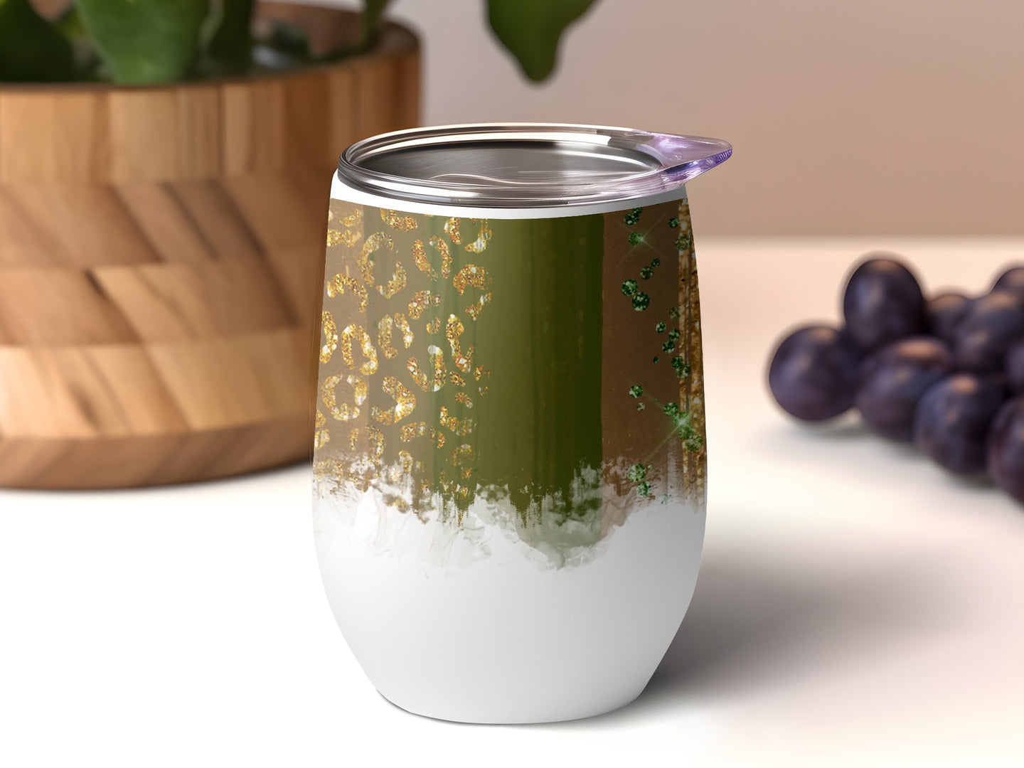 Glitter leopard print tumbler with white base and green accents.