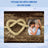 Heart-shaped rope and couple in photo frame on wood background.