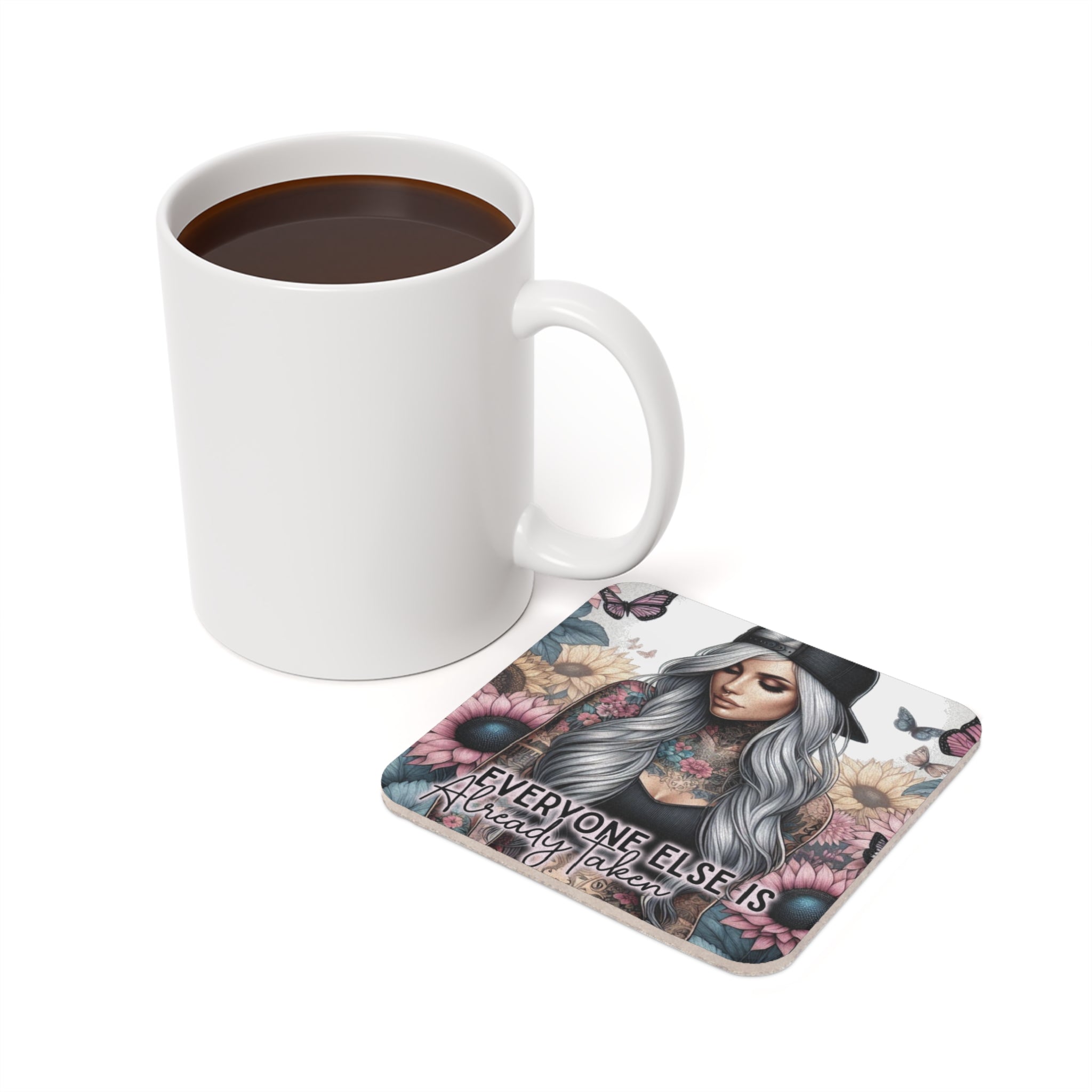 Coaster with tattooed woman and text "EVERYONE ELSE IS Already Taken" next to mug.