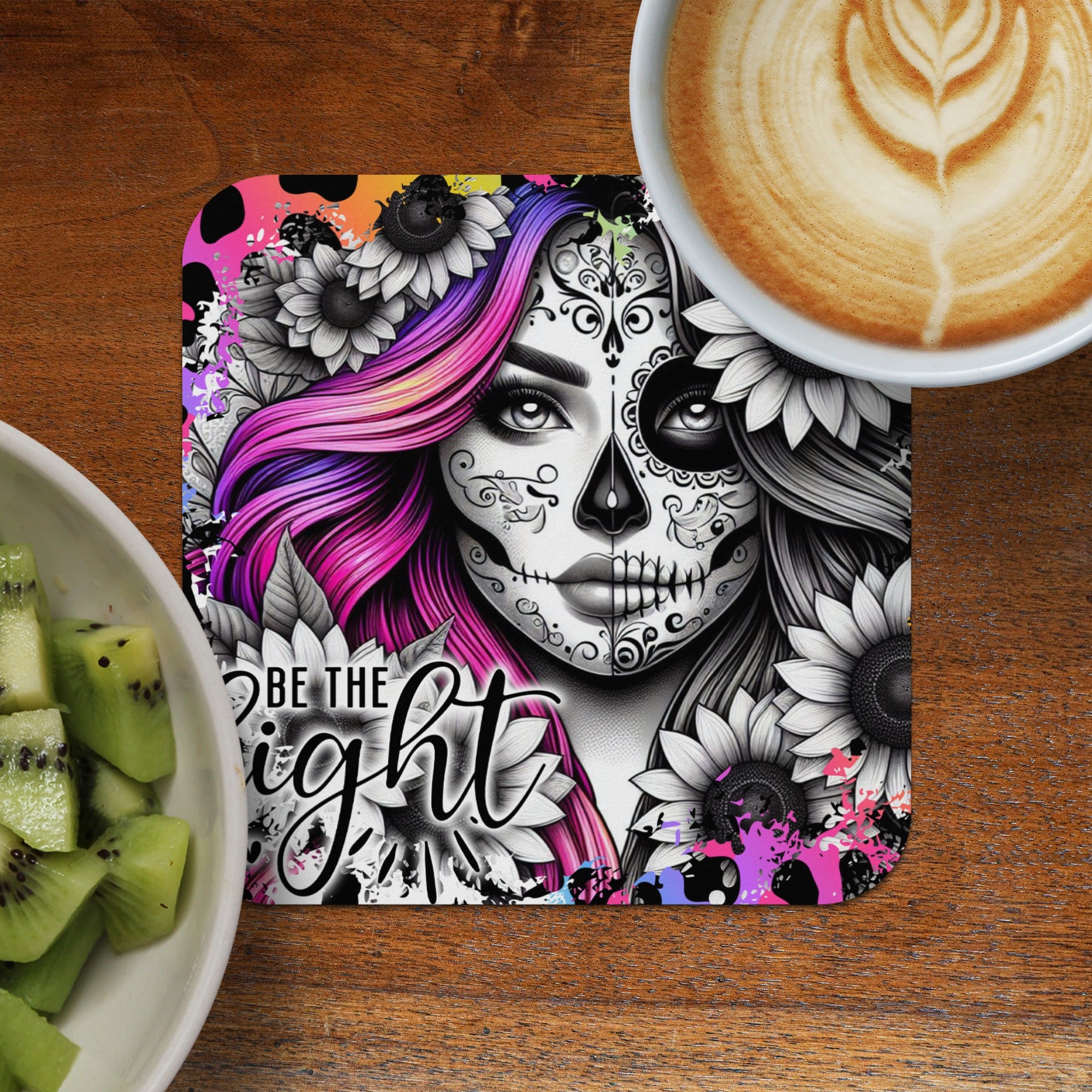 Day of the Dead skull art with sunflowers and a coffee cup and kiwi.