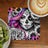 Day of the Dead skull art with sunflowers and a coffee cup and kiwi.