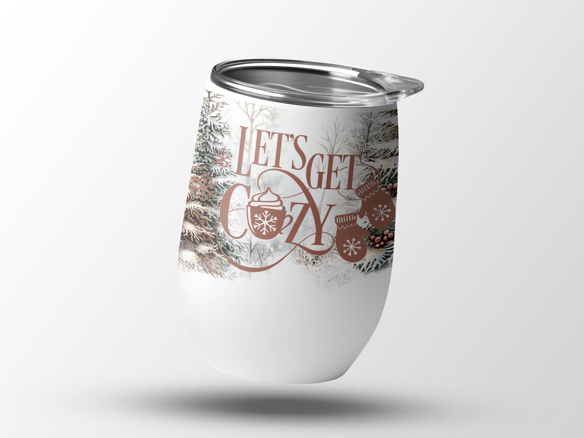 White tumbler with "Let's Get Cozy" and winter imagery.